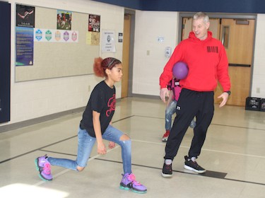 Coach Mike Kozak with student